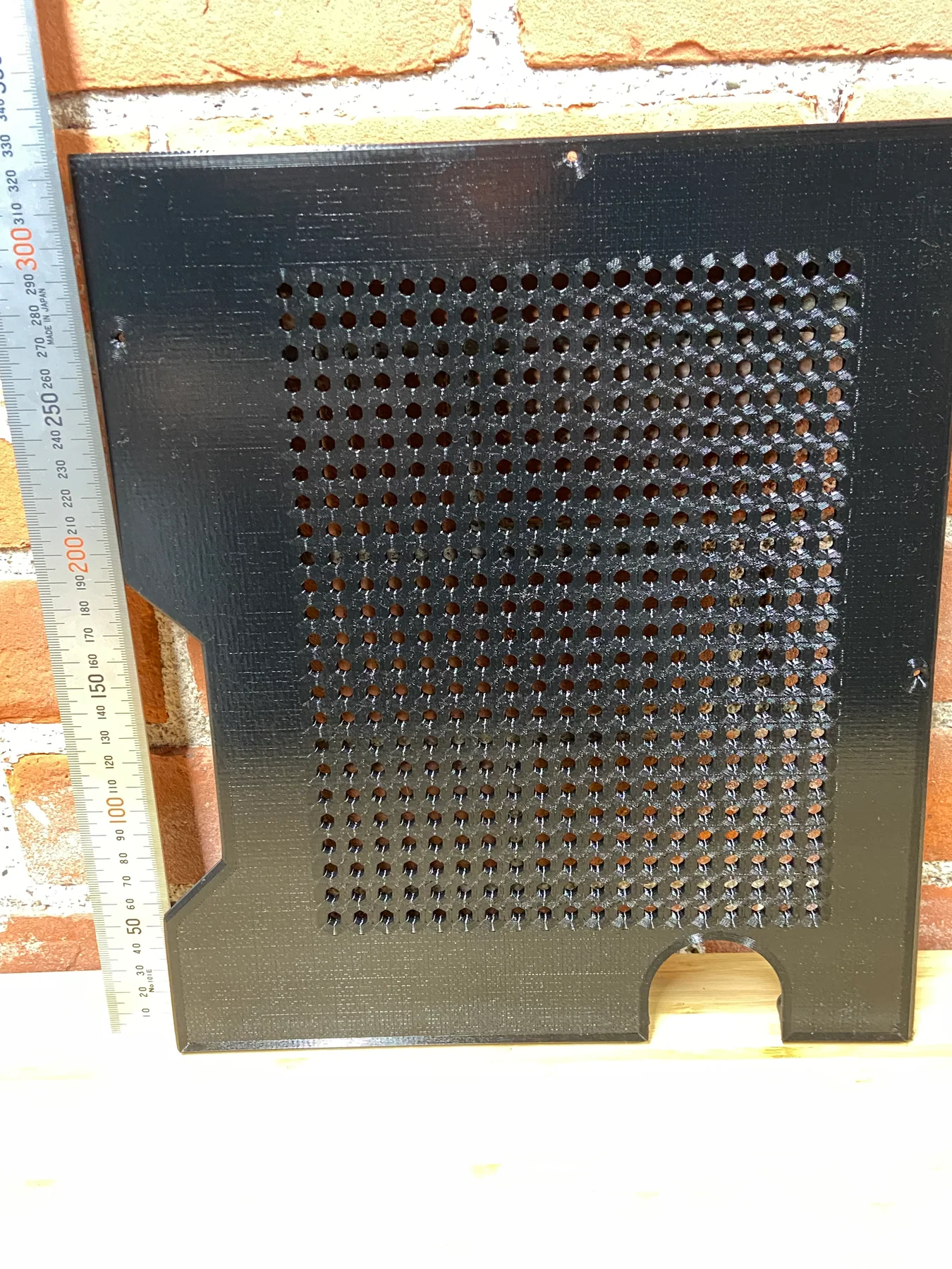 Close view of the hexagonal ventilation pattern on the glossy printed panel