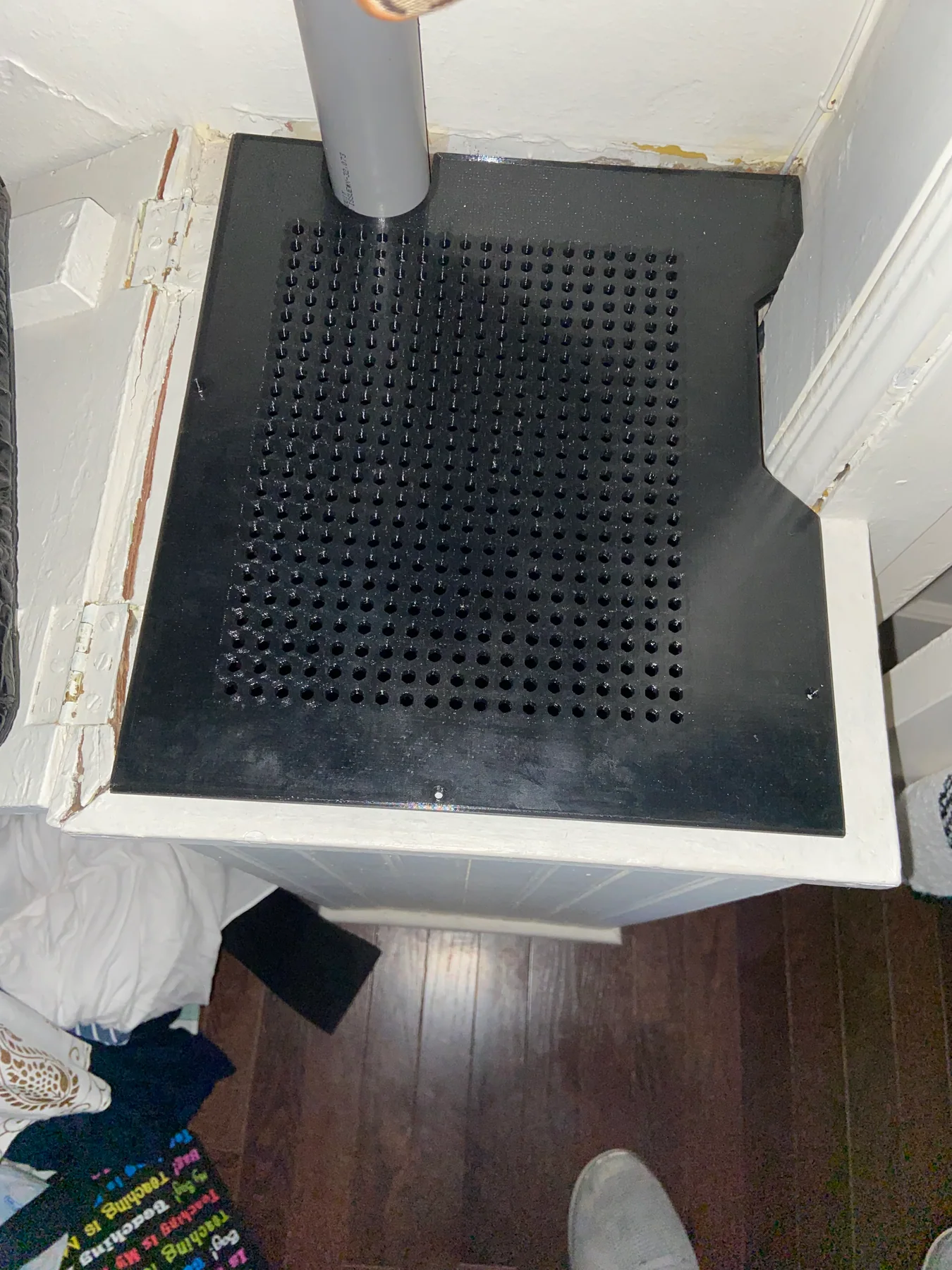 The printed panel installed over the HVAC opening