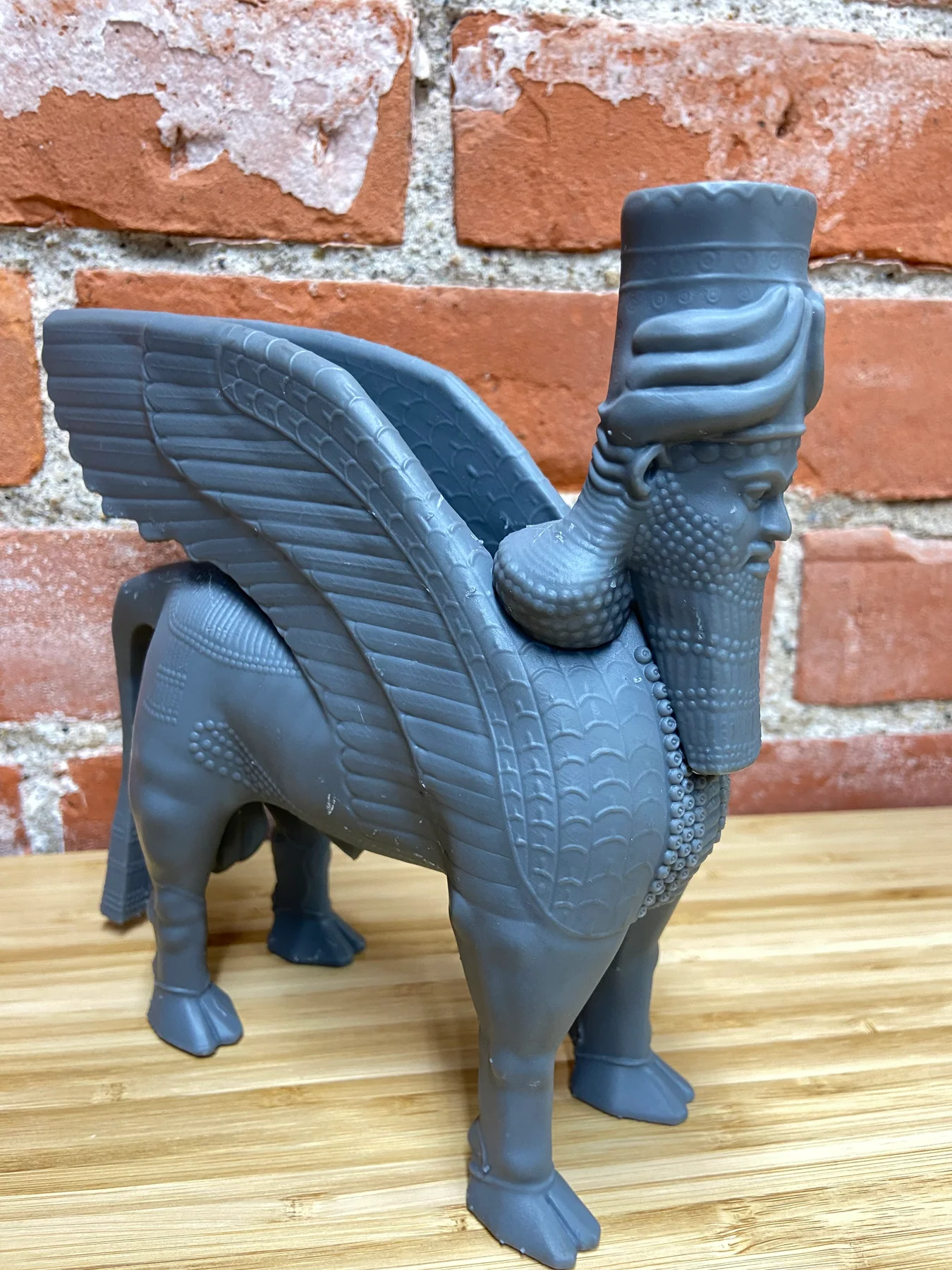 Side profile of the resin lamassu print showing the full wing sweep