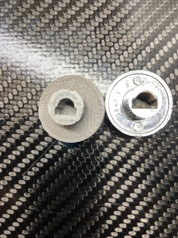 Printed control knob beside the original chrome knob